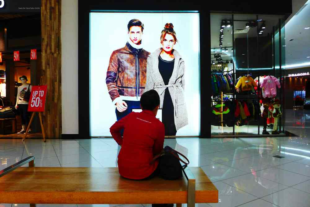A person is looking at an LED screen display.