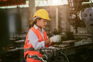 A worker working in a manufacturing warehouse.